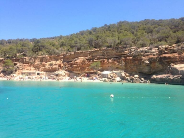 View of a beach in Ibiza from a boat