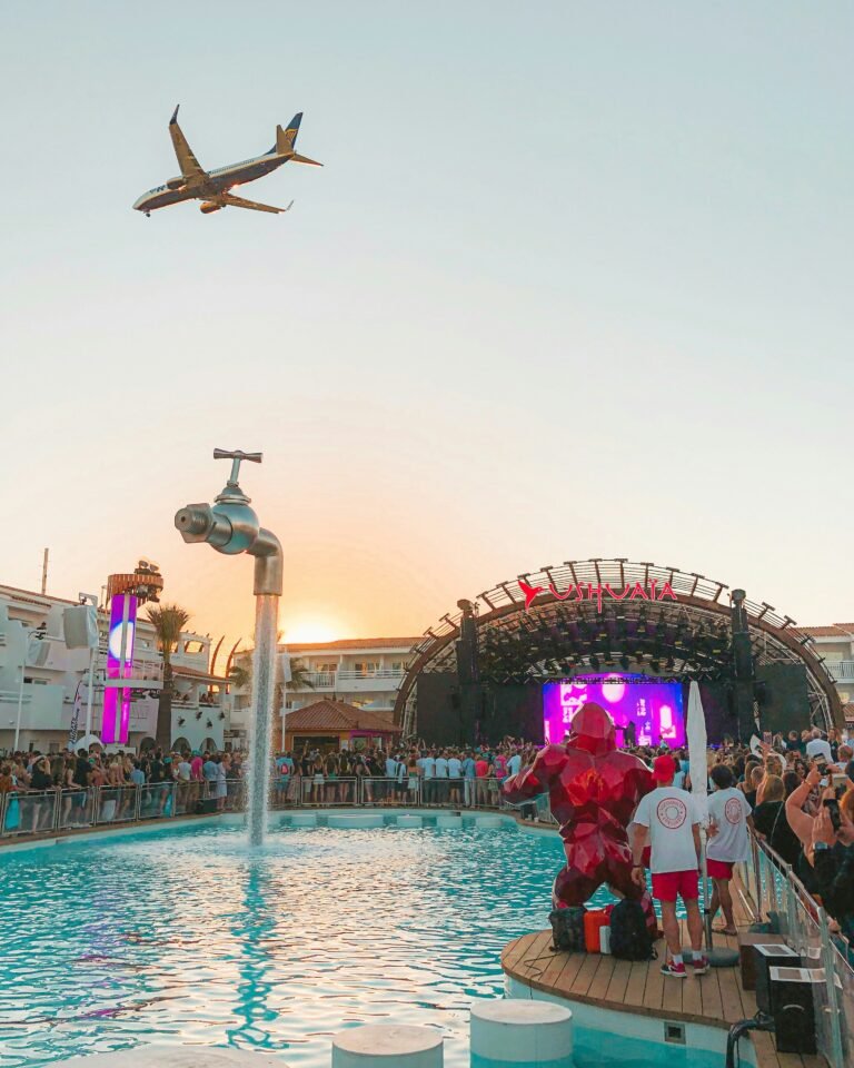 Ushuaia pool and stage with plane flying over